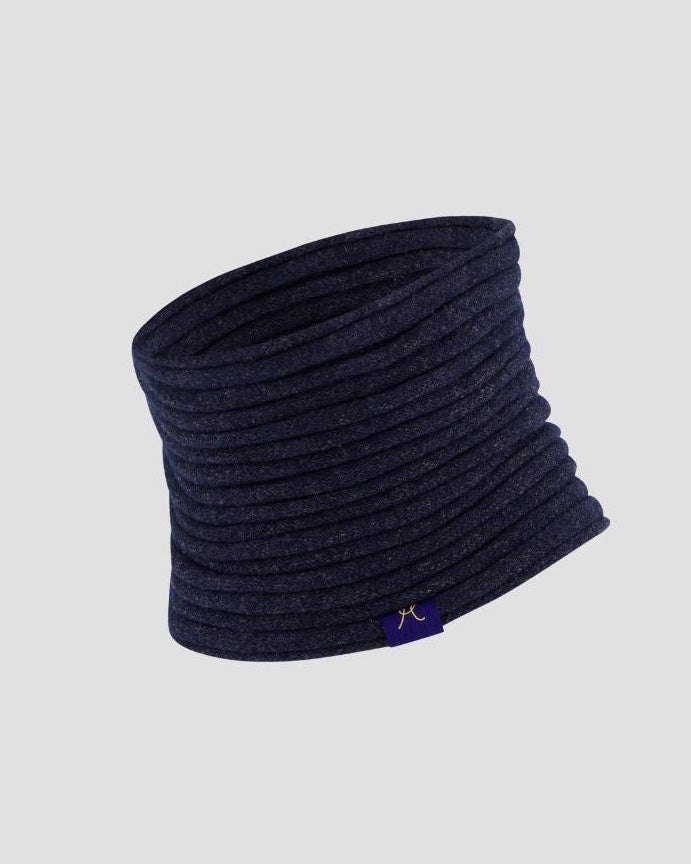 Navy blue knitted neck warmer on a light gray background