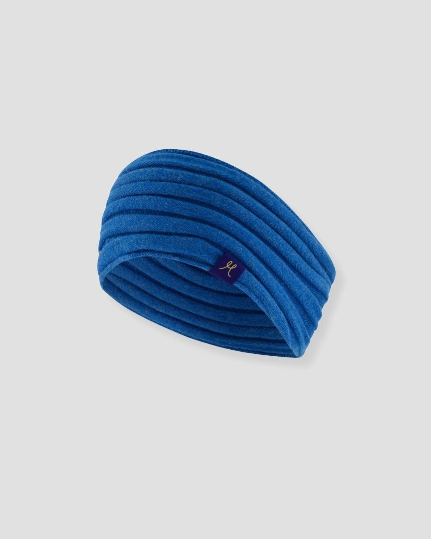 Blue headband with a brand logo on a light gray background