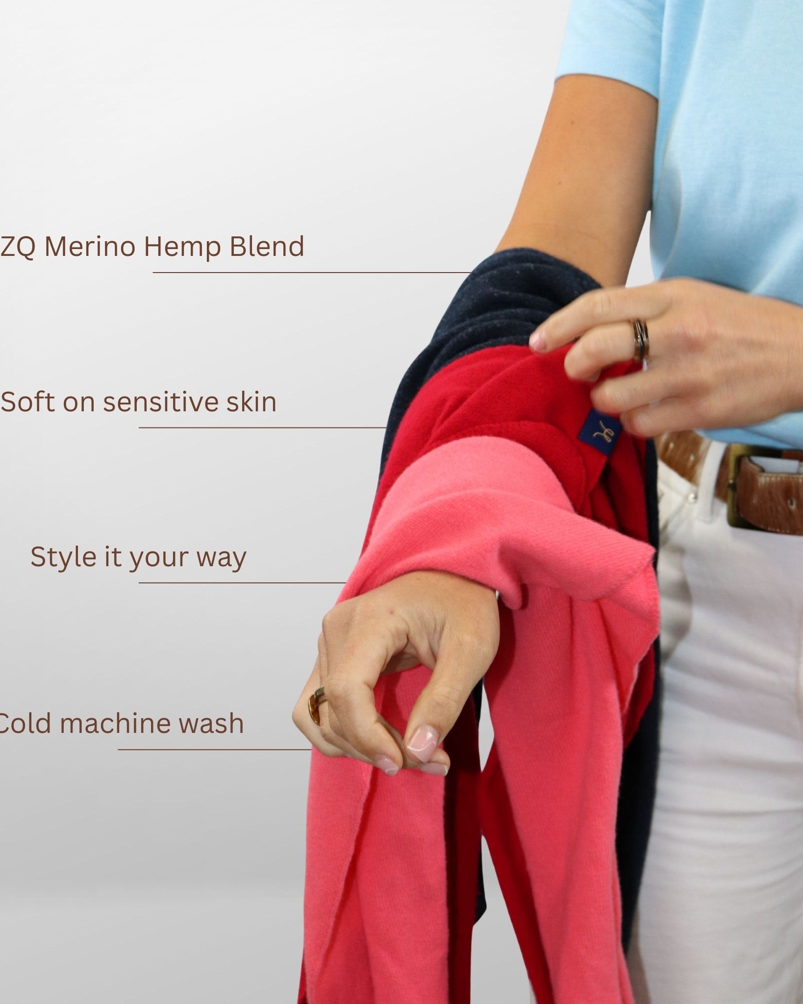 Person holding a red garment with text about ZQ Merino Hemp Blend on a white background