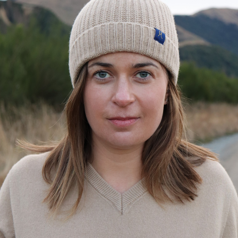 Beige chunky knit beanie wool hat and jersey made from hemp and merino on a lady.