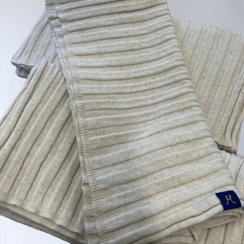 White cream scarf with rib knit design. Looks soft and warm. Made from hemp and merino wool.
