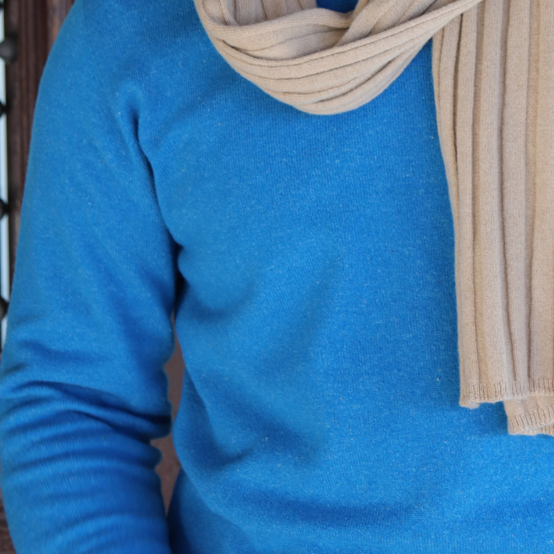 Bright blue jersey, worn with a beige rib knit scarf. Knitwear brand Hemprino, made from hemp and merino from Glenaan Station.