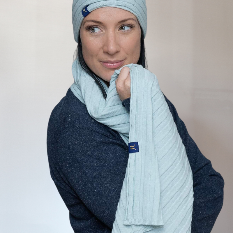 Lady wears matching hemprino set. Rib knit scarf and headband in light blue candy mist