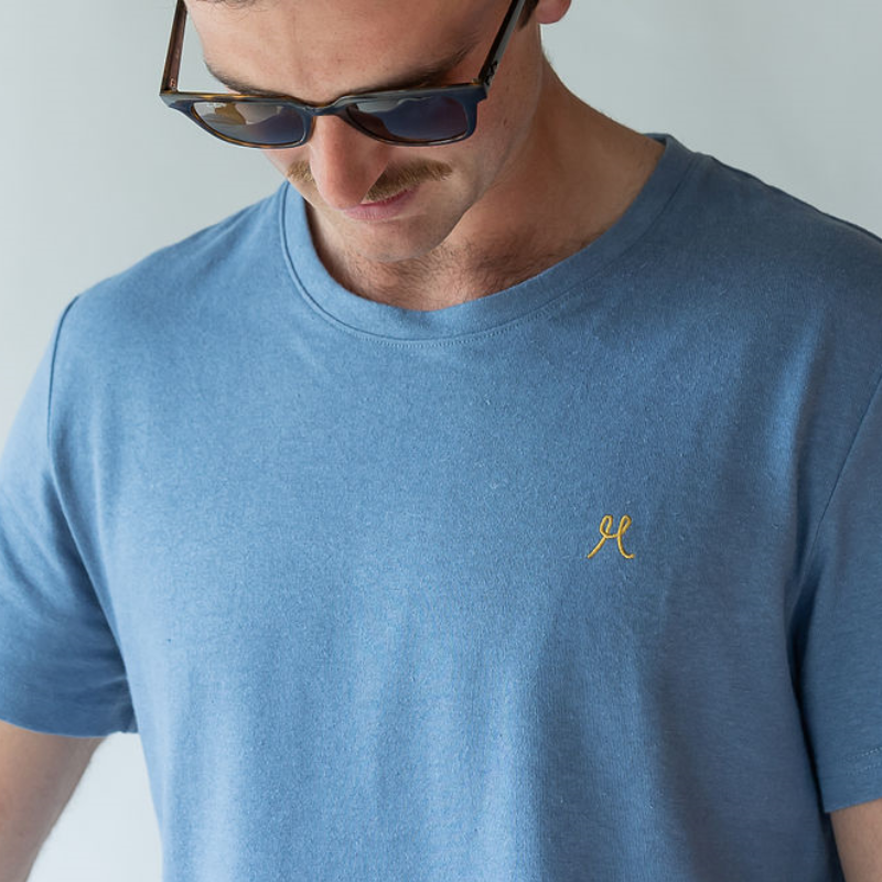 Hemp and Organic cotton unisex tshirt in light blue. Paired with rayban sunglasses.