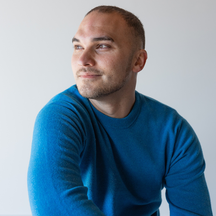 Man wearing a bright blue crew neck jersey and looking thoughtful and relaxed. Hemprino made from Hemp and Merino and made in New Zealand.