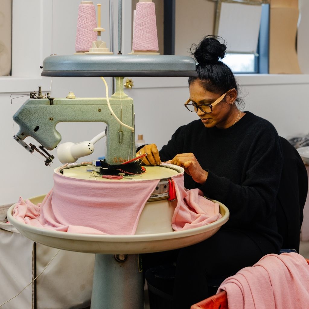 Beverley Productions team member knitting Hemprino garments, Tauranga