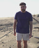 Man in Navy Tshirt on beach